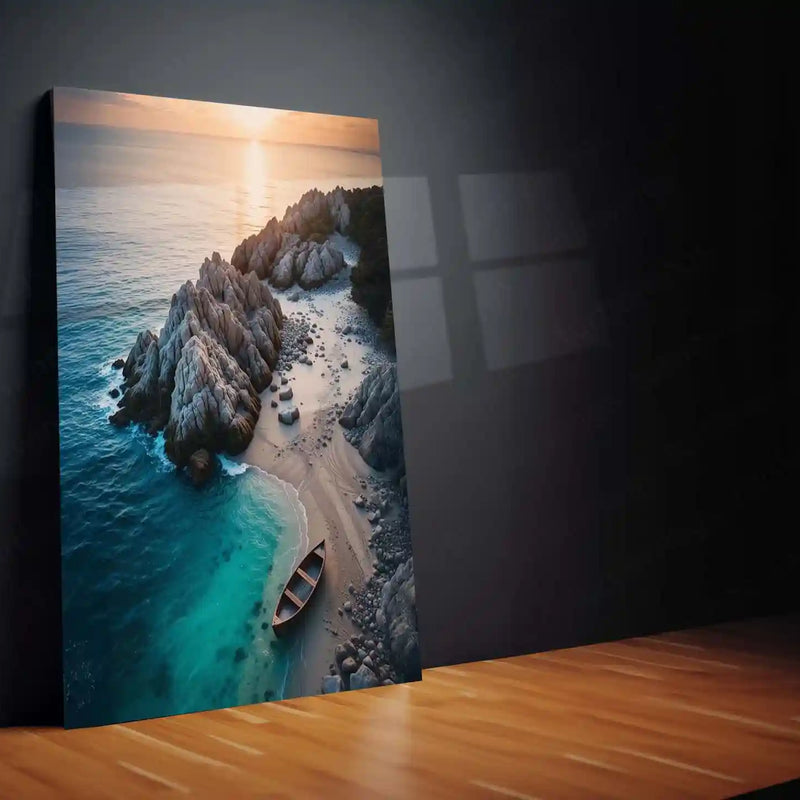 Serene Sunset Cove with Wooden Rowboat and Rocky Shoreline Metal Frame | Aerial Coastal Wall Art - TURTLEWINGS